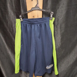 Mens size large official NFL blue and green basketball shorts with Seattle logo